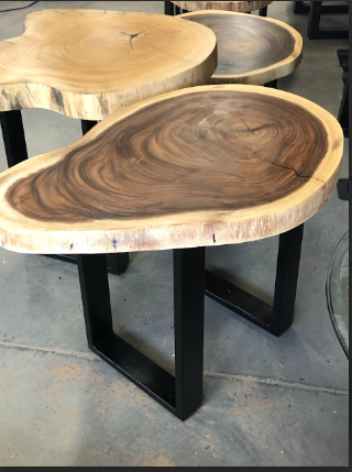 Live edge wooden coffee table with dark wood grain, light wood edge, and black metal legs.