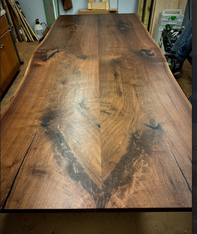 A large wooden table with a chevron pattern on it