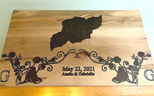 A wooden cutting board with a map of a lake on it.