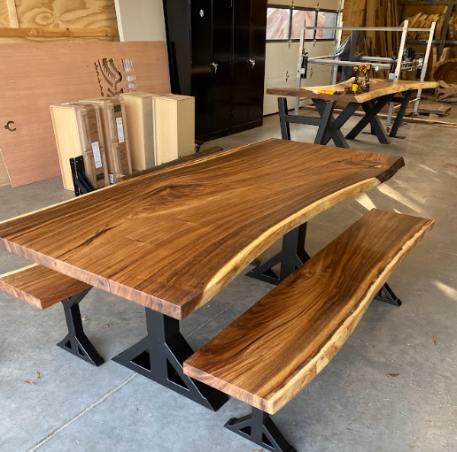 A wooden table with two benches in a room