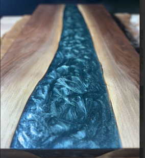 A unicorn is painted on a piece of wood.