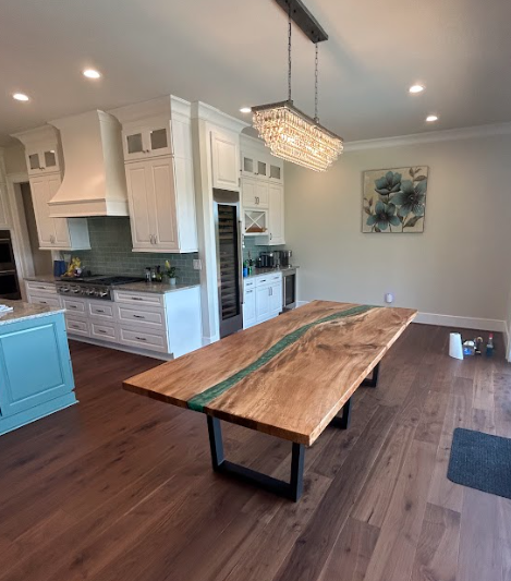 A wooden table with a blue river in the middle