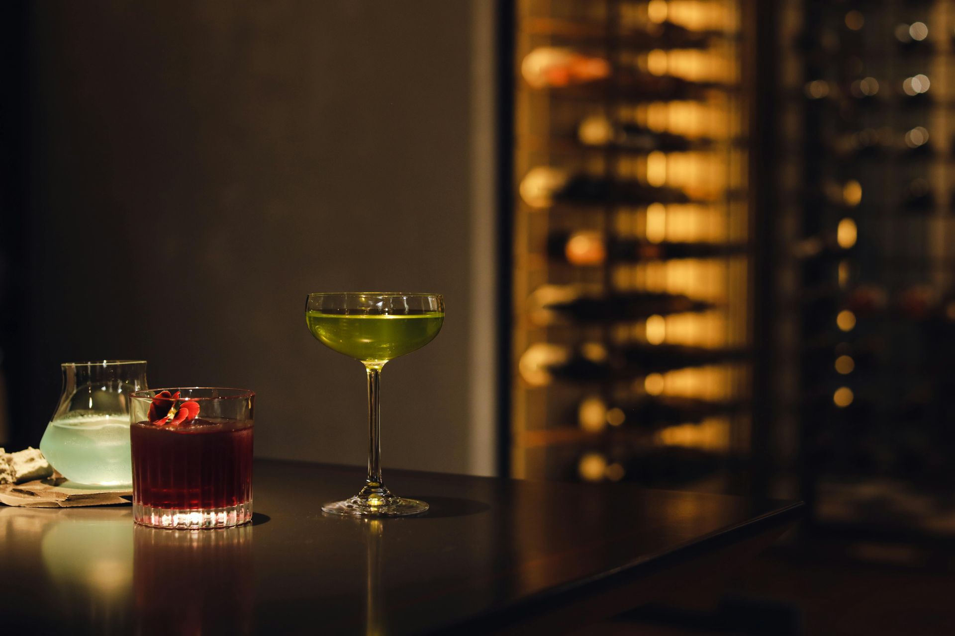 A wooden table is sitting on a concrete floor in a room.