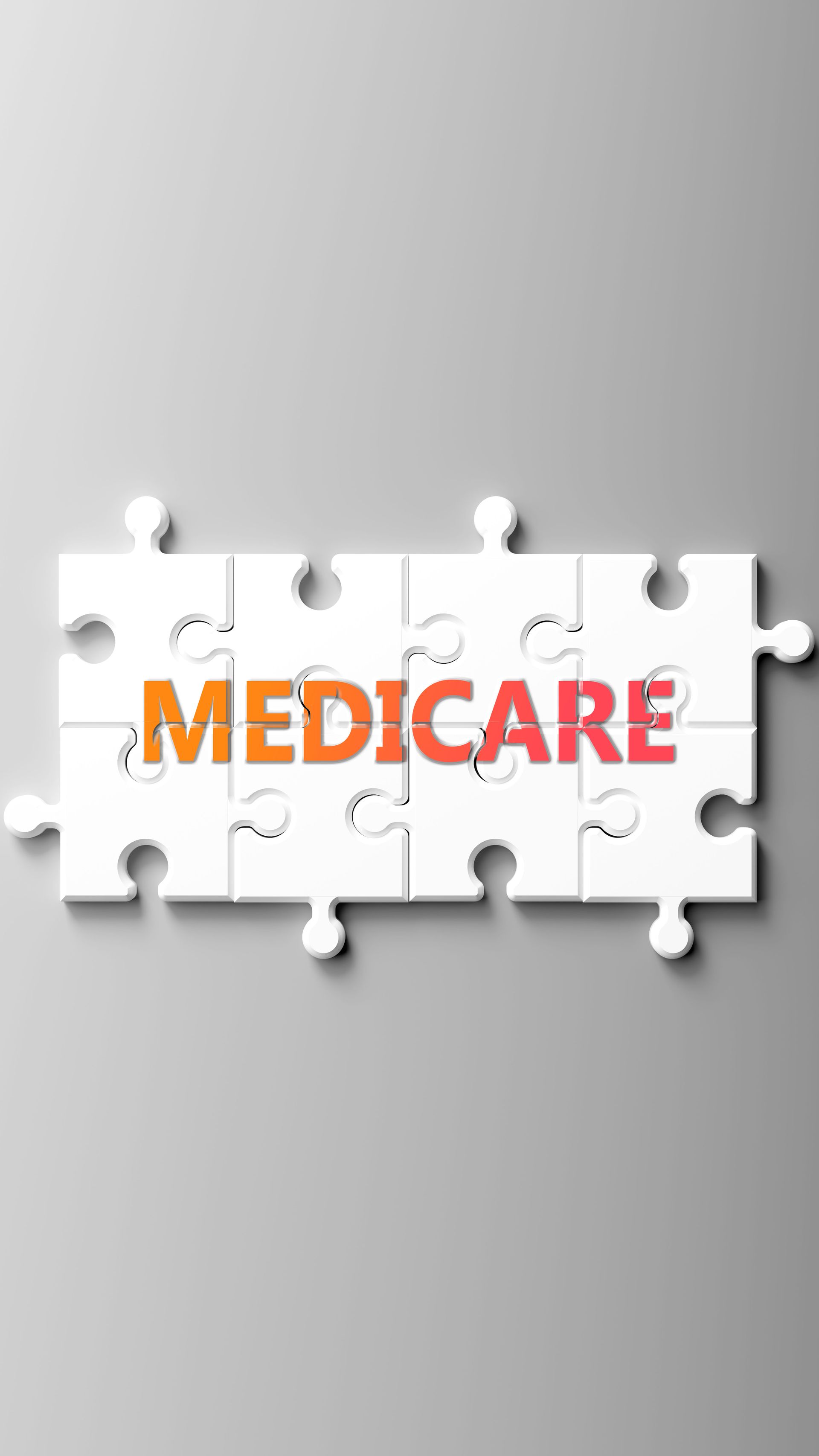 A group of elderly people are sitting at a table playing cards.