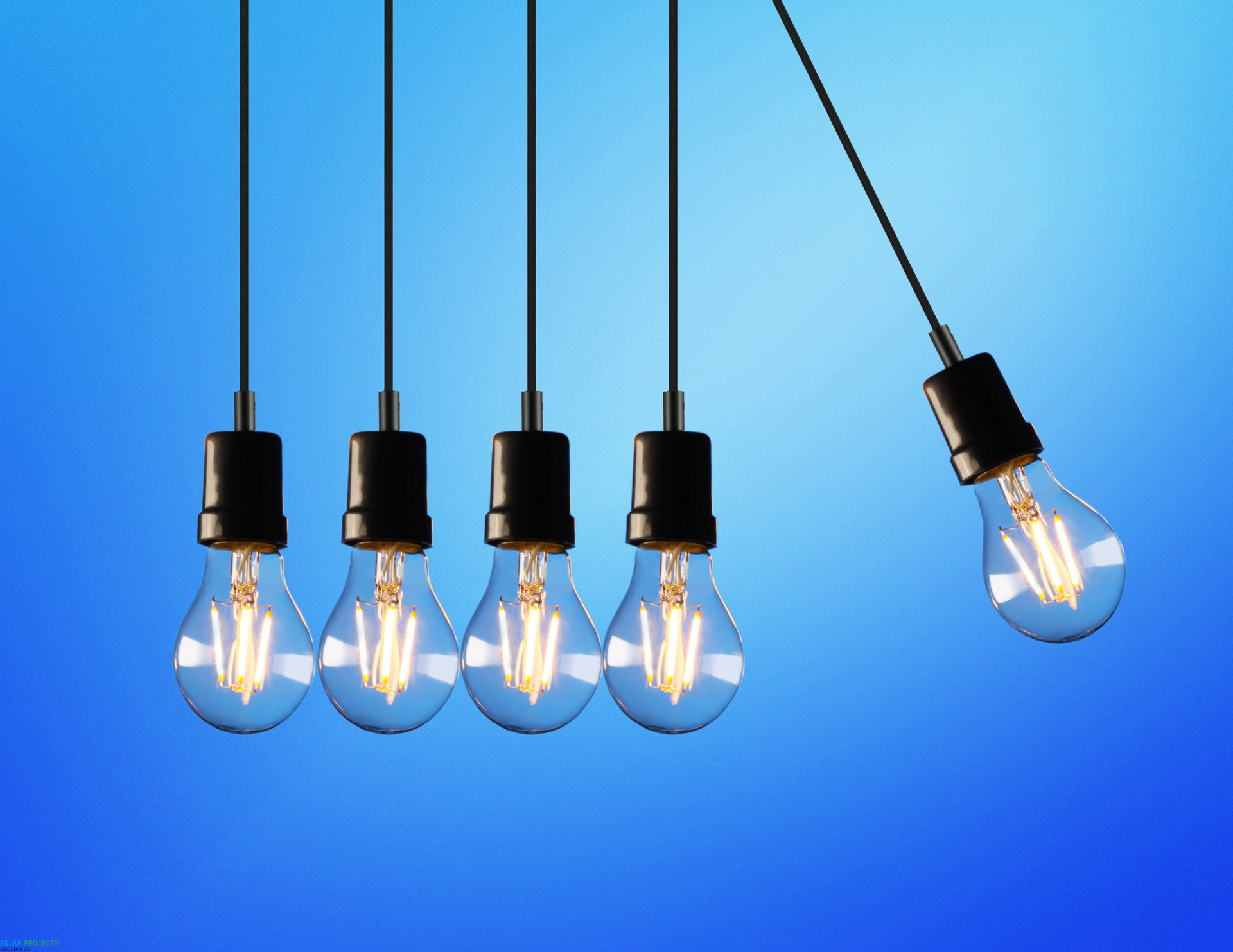 A row of light bulbs hanging from a string on a blue background