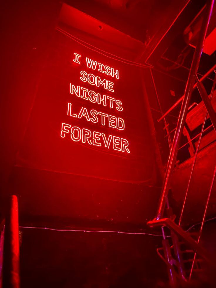 A red neon sign that says `` i wish some nights lasted forever ''