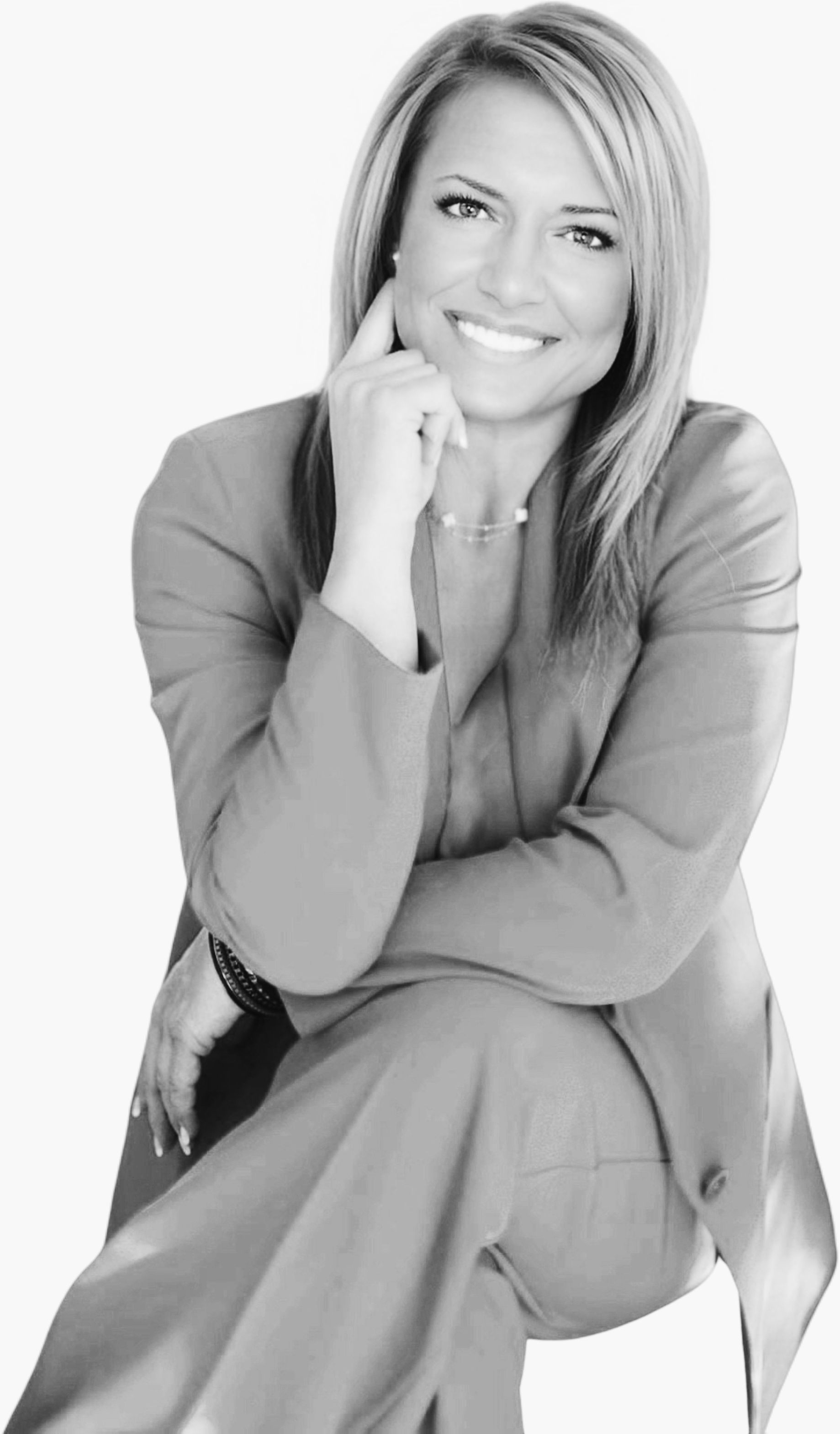 A living room with a couch , two coffee tables and a mirror.