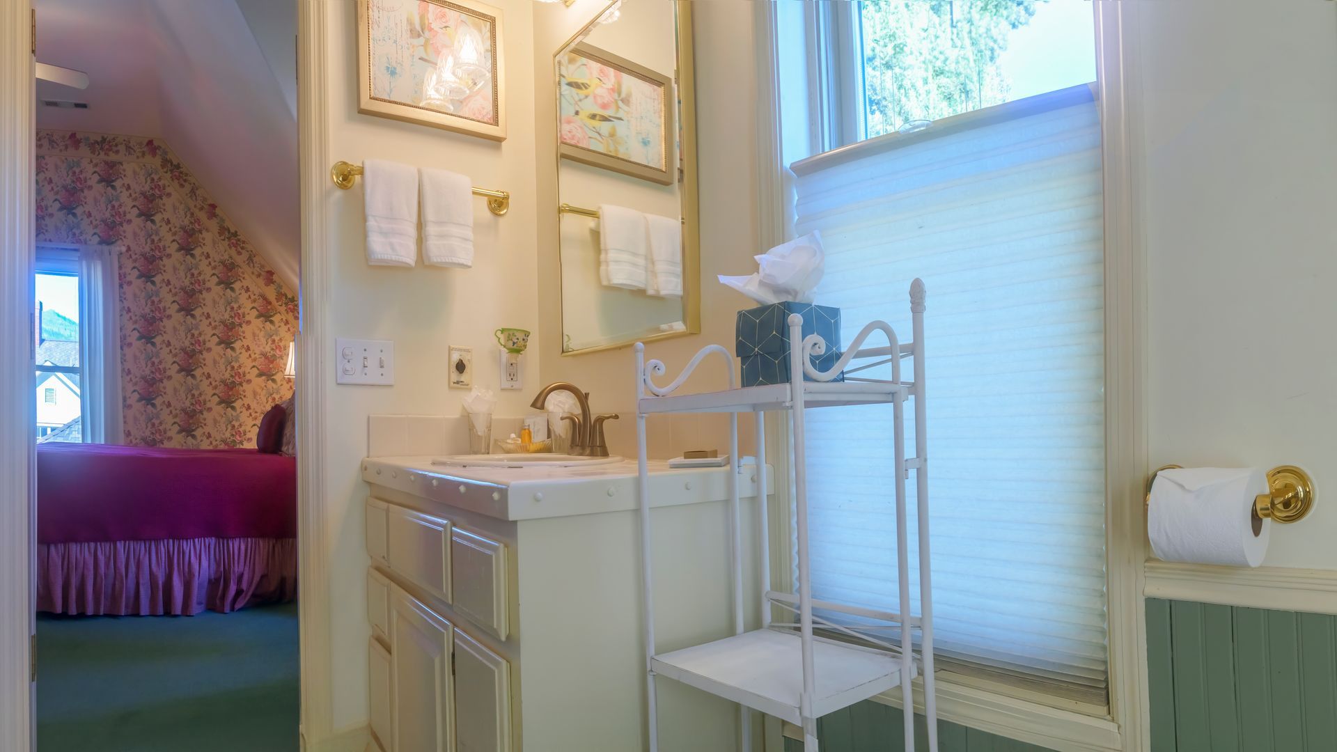 A bathroom with a sink , mirror , and shelf.