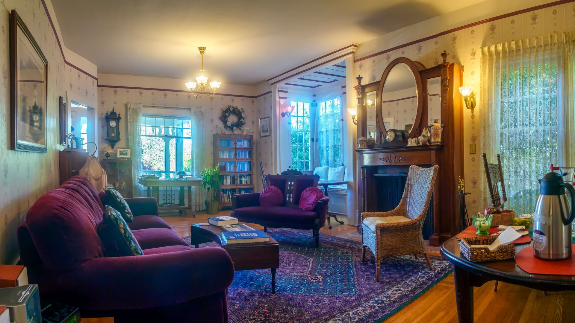 A living room filled with furniture and a fireplace.