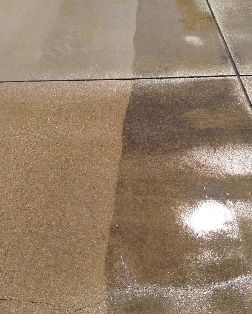 A before and after picture of a concrete floor being cleaned with a pressure washer.
