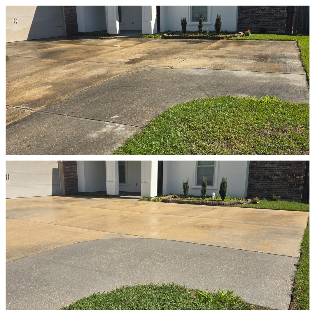 Before-and-after view of a concrete driveway being cleaned, showing a transition from dark, stained to lighter surfaces.
