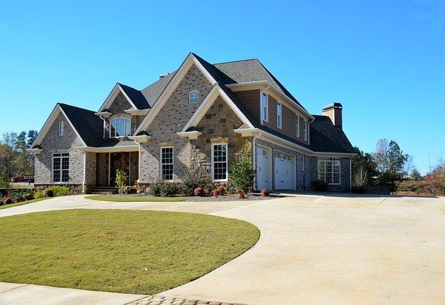 A concrete driveway leads up to a quaint suburban home in Green Bay.
