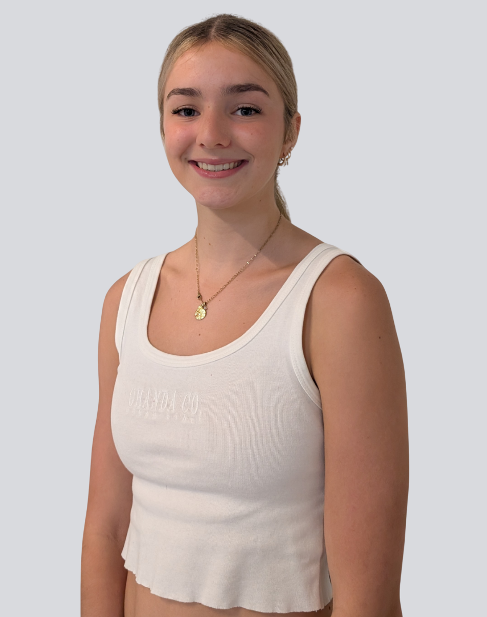 The girl is wearing a white t-shirt and a ponytail.