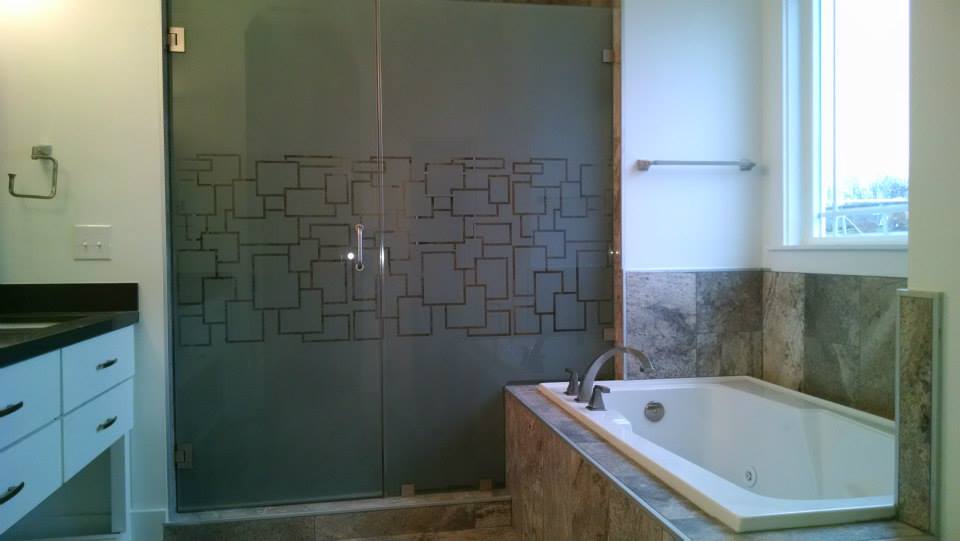 a bathroom with a bathtub and a shower with squares on it