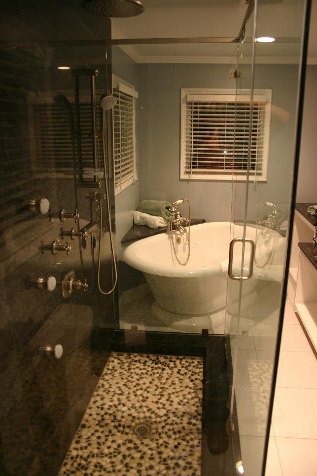 a bathroom with a large tub and a shower