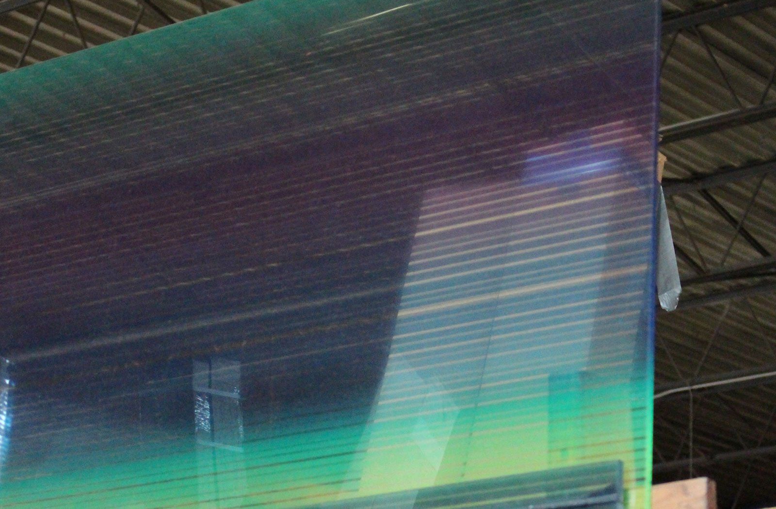 a large piece of glass with a rainbow of colors