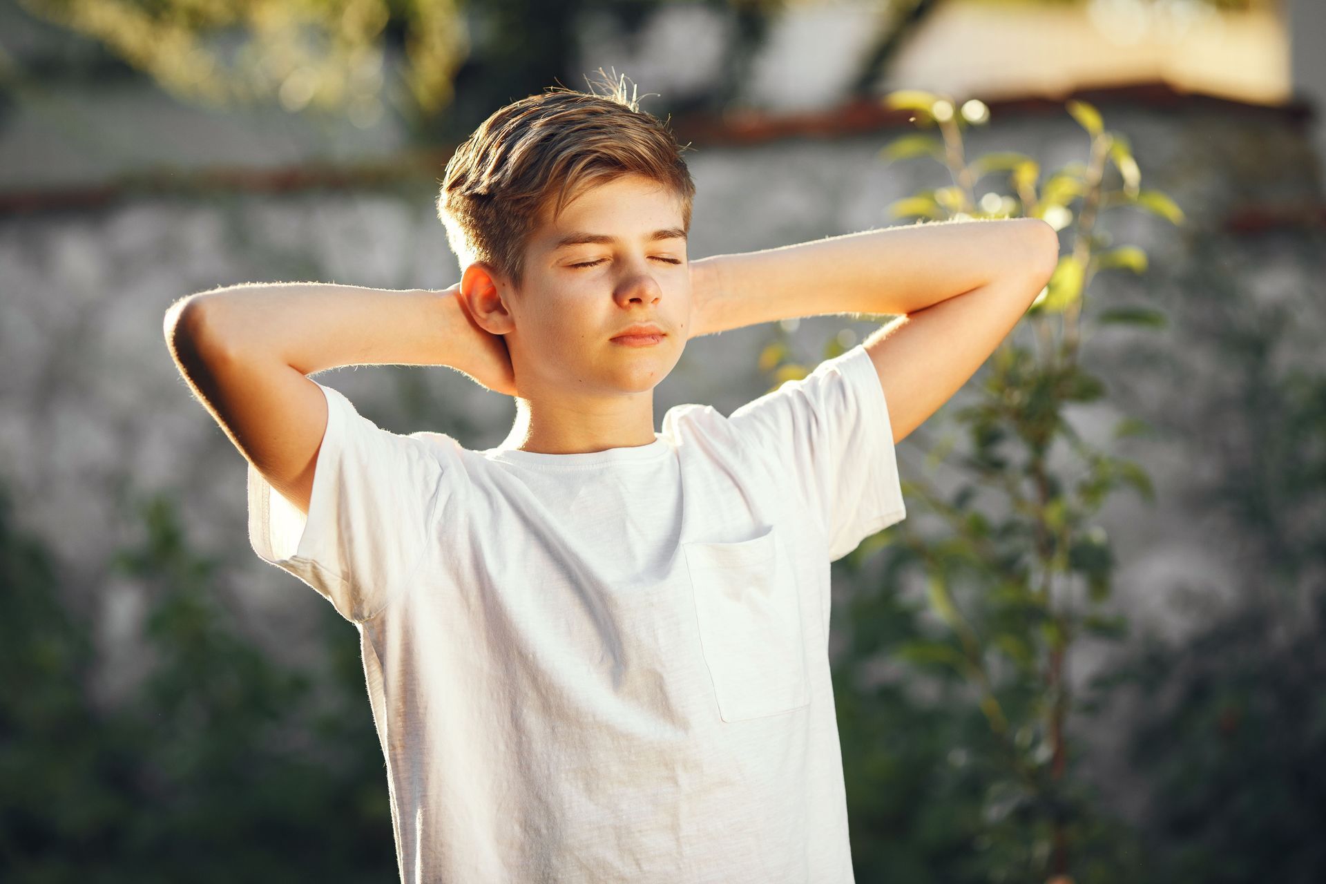A teen boy is relaxing.