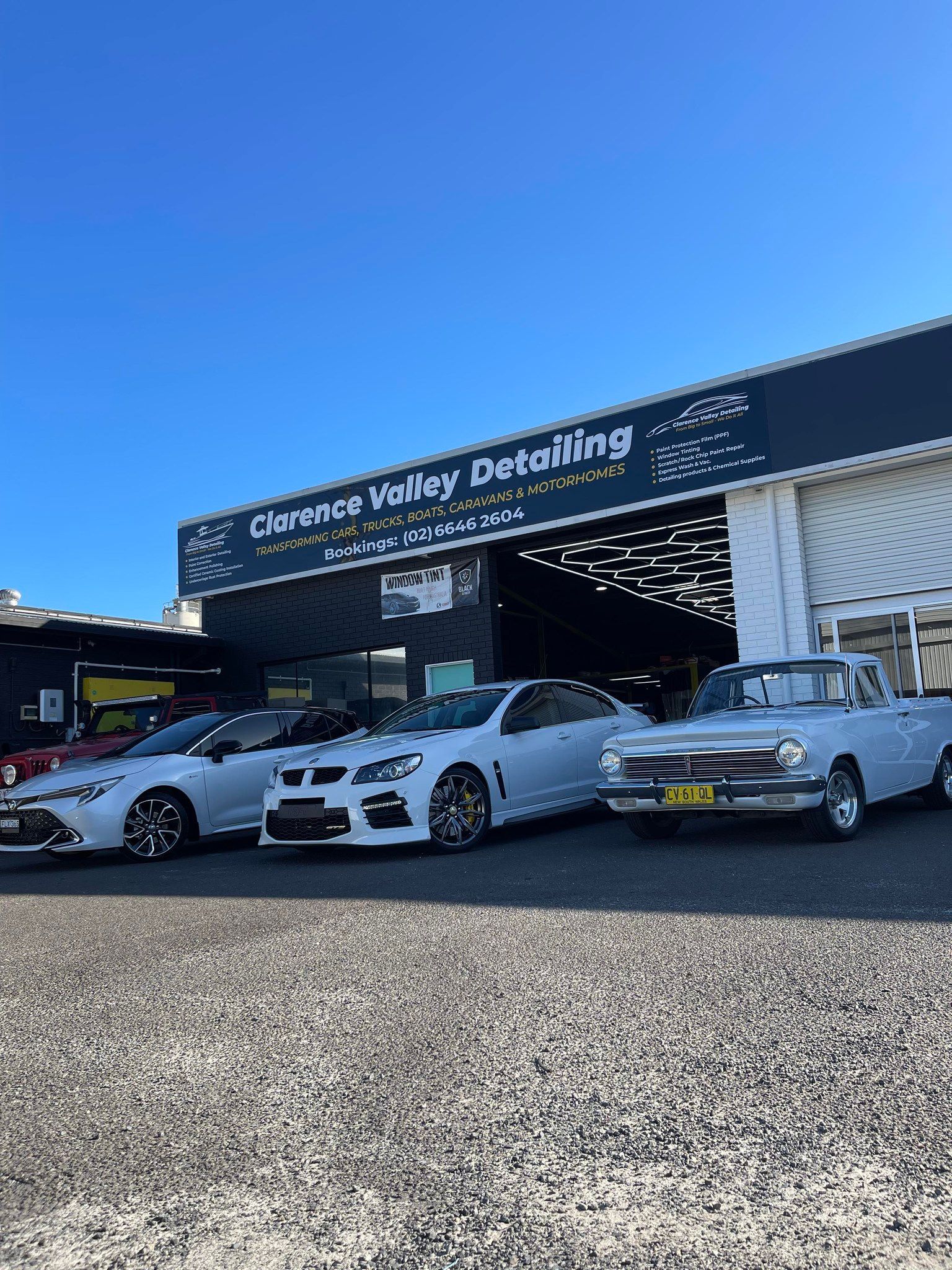 Three Cars Are Parked in Front of Clarence Valley Detailing — Clarence Valley Detailing In Yamba, NSW