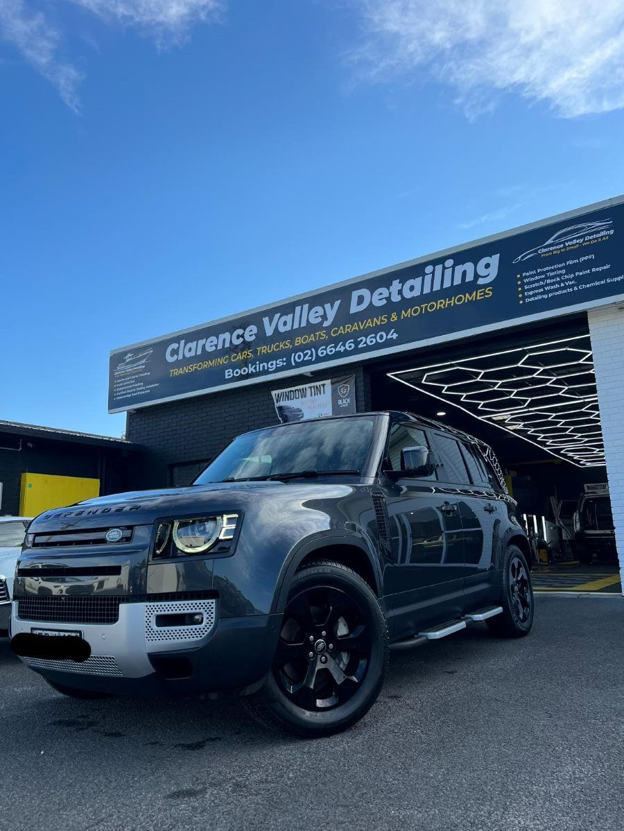 Dark Gray Land Rover Defender Parked in Front of a Detailing Shop — Clarence Valley Detailing In Yamba, NSW