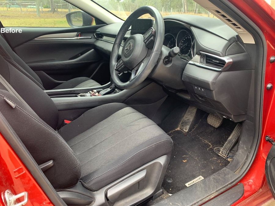 Interior View of a Red Mazda Car, Dirty Floor Mat — Clarence Valley Detailing In Coffs Harbour, NSW