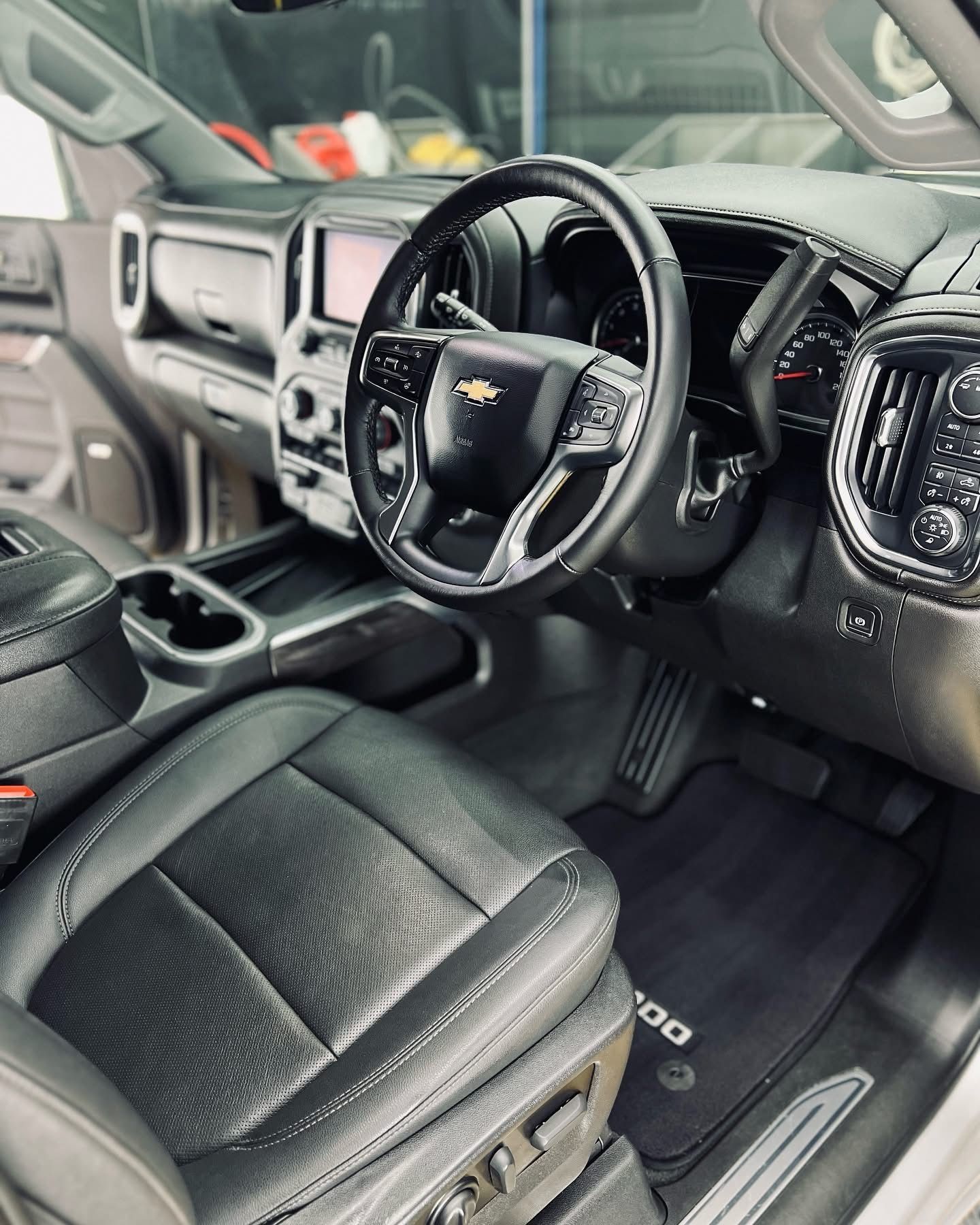 The Front Seat of a Black Car With Black Leather Seats and a Black Mat — Clarence Valley Detailing In Yamba, NSW