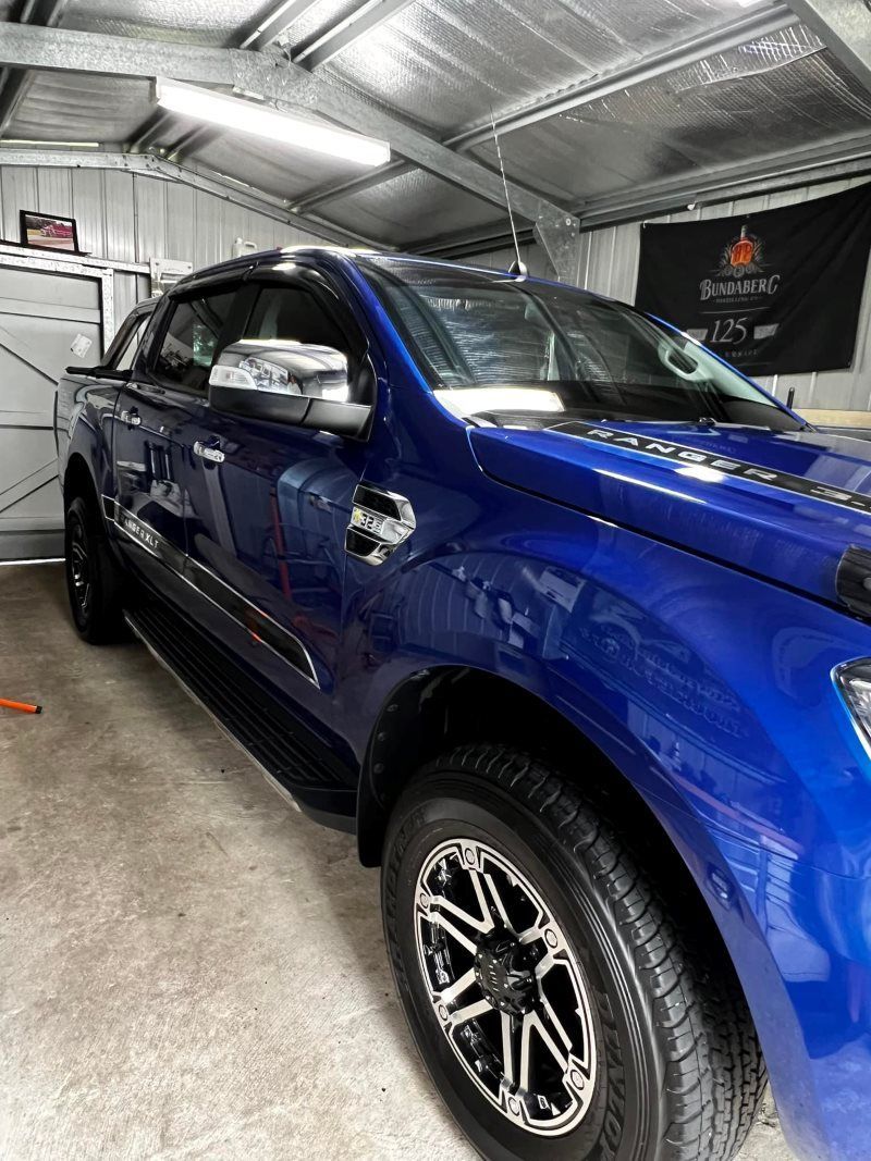 Blue Ford Truck Parked Inside a Garage With Silver Reflective Roof — Clarence Valley Detailing In Grafton, NSW