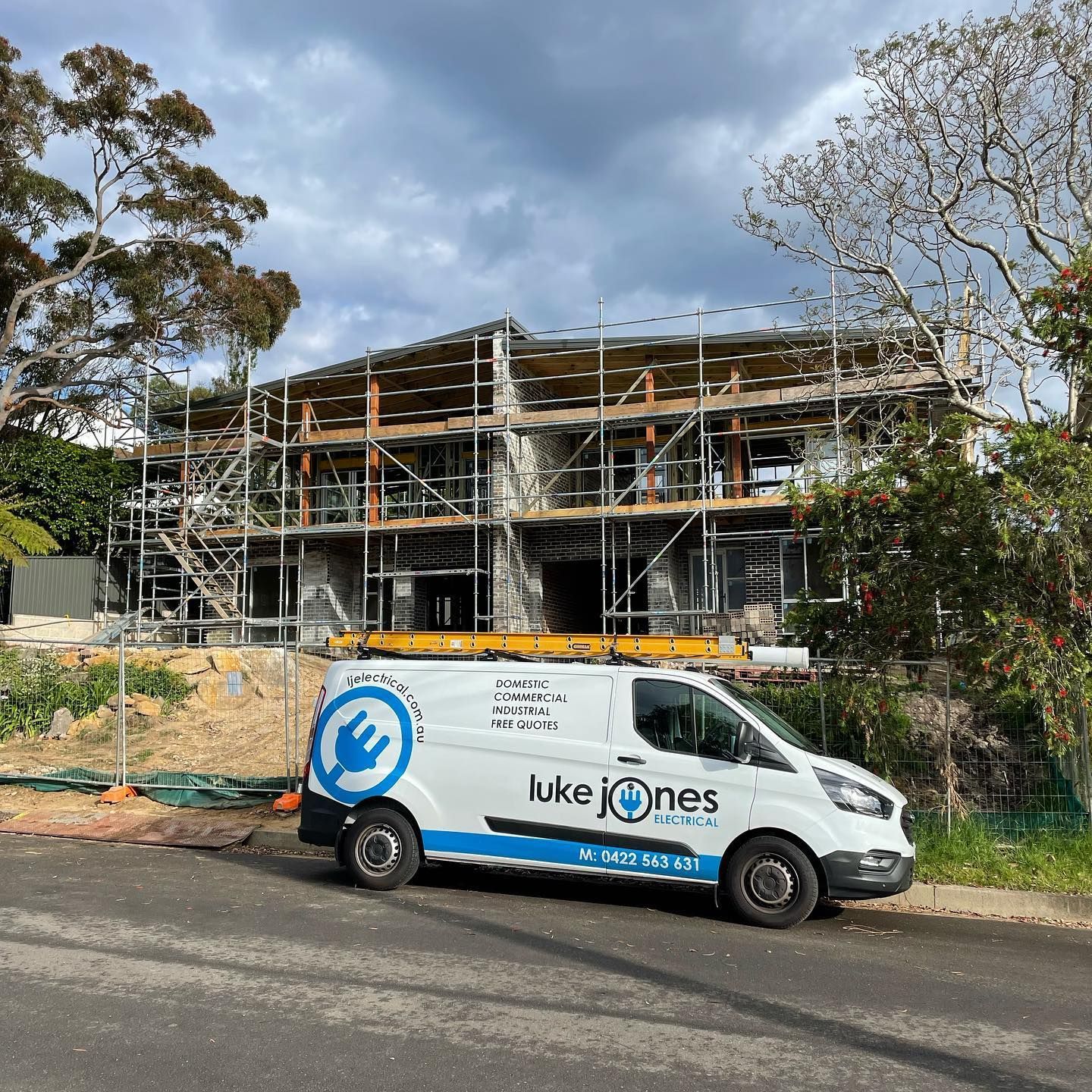 Electrician Fixing Light Fixtures On The Living Room — Luke Jones Electrical In Bellambi, NSW