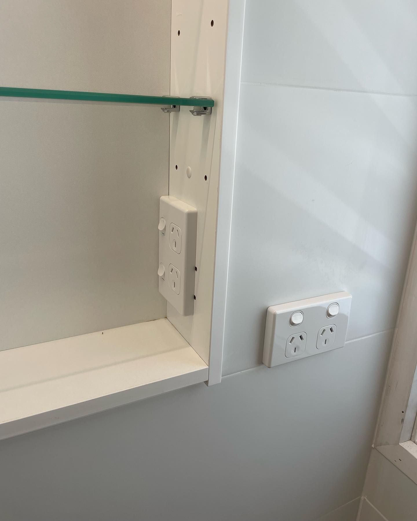 A Digital Multimeter Is Sitting On Top Of A Circuit Board — Luke Jones Electrical In Bellambi, NSW