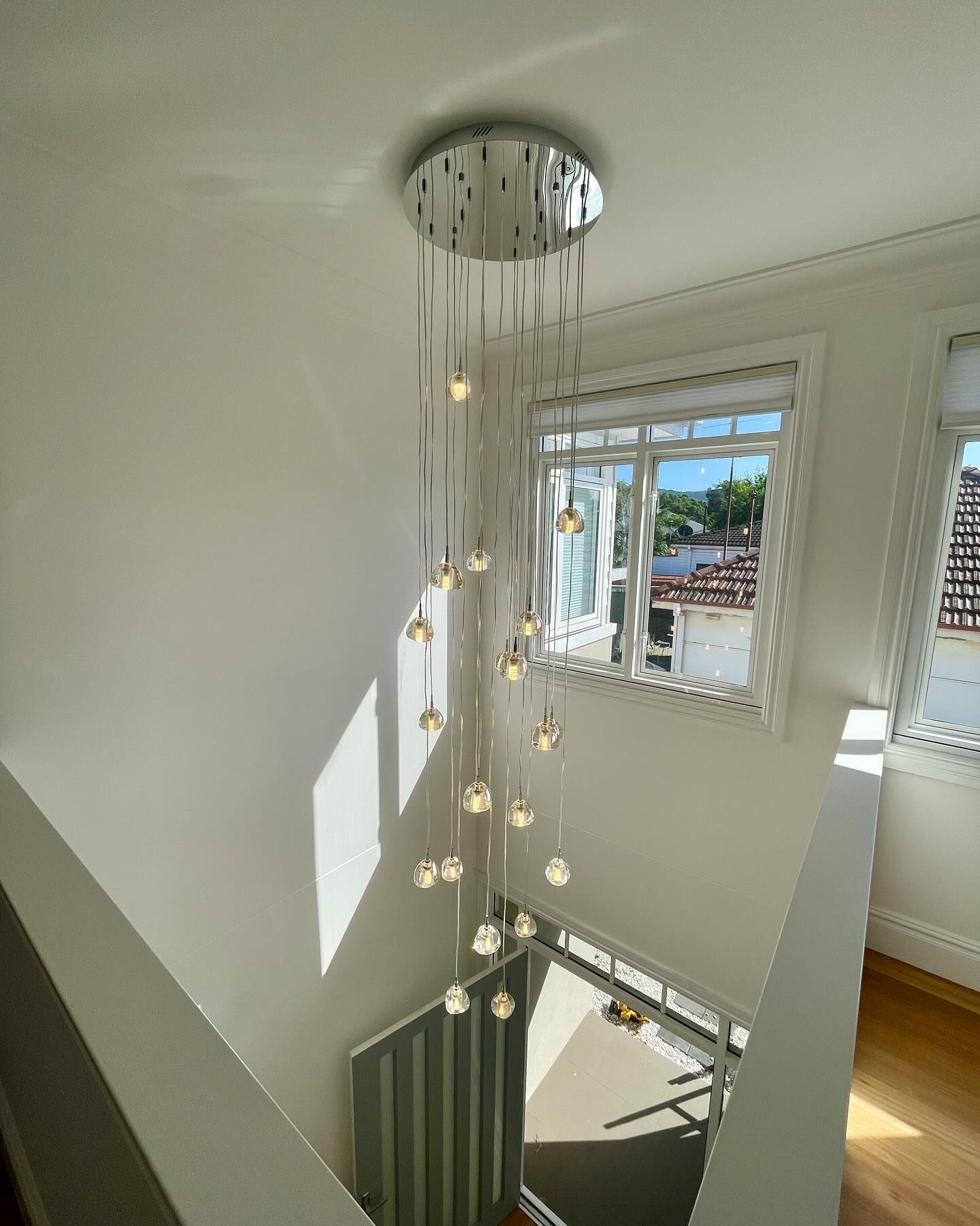 A Close Up Of A Light Bulb Hanging From The Ceiling — Luke Jones Electrical In Fairy Meadow, NSW