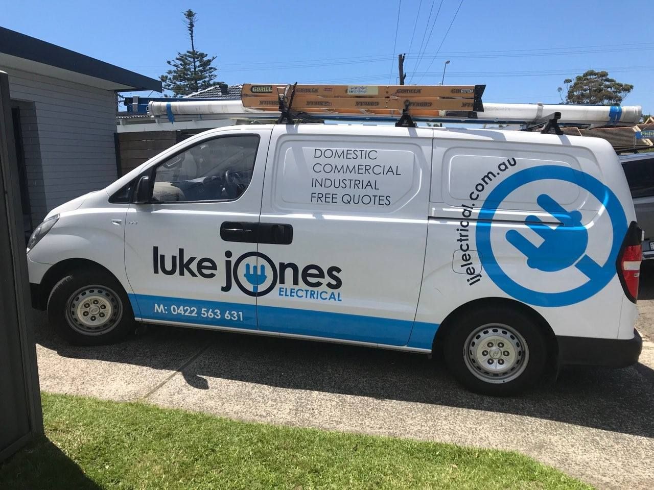 An Electrical Engineer Is Working On A Control Panel In A Factory — Luke Jones Electrical In Bellambi, NSW