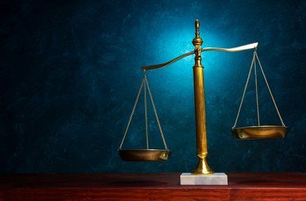 weighing scale blue background — workers' comp attorney in Owatonna,MN weighing scale blue background — workers' comp attorney in Owatonna,MN