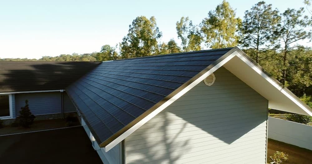 An Aerial View Of A House With A Black Roof — Southern Bricks & Pavers In Ulladulla, NSW