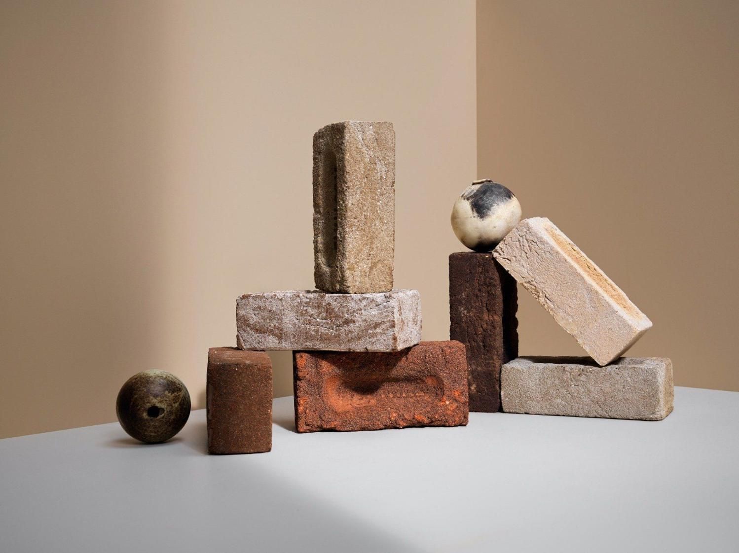 A Group Of Bricks Stacked On Top Of Each Other On A Table — Southern Bricks & Pavers In Ulladulla, NSW