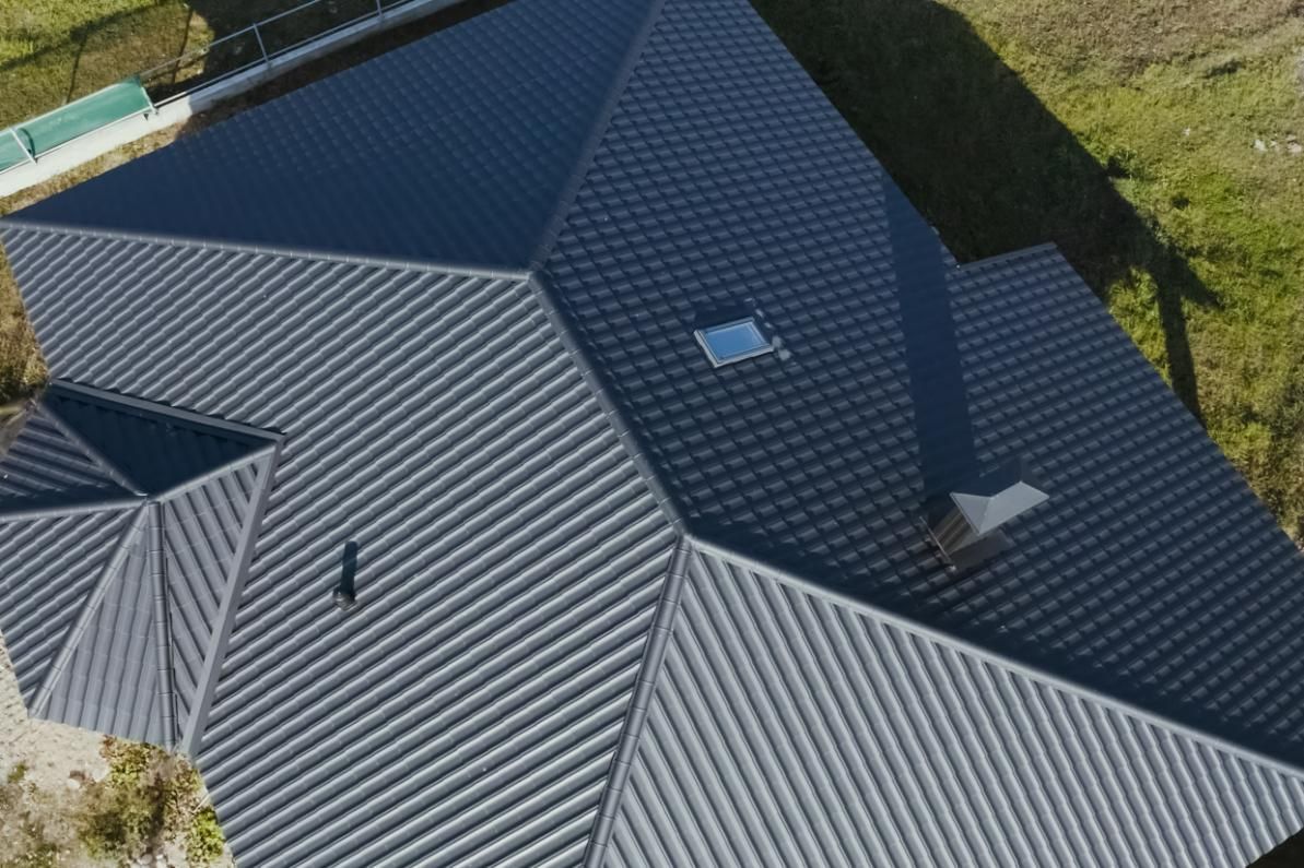 An Aerial View Of A House With A Gray Roof And A Skylight — Southern Bricks & Pavers In Ulladulla, NSW