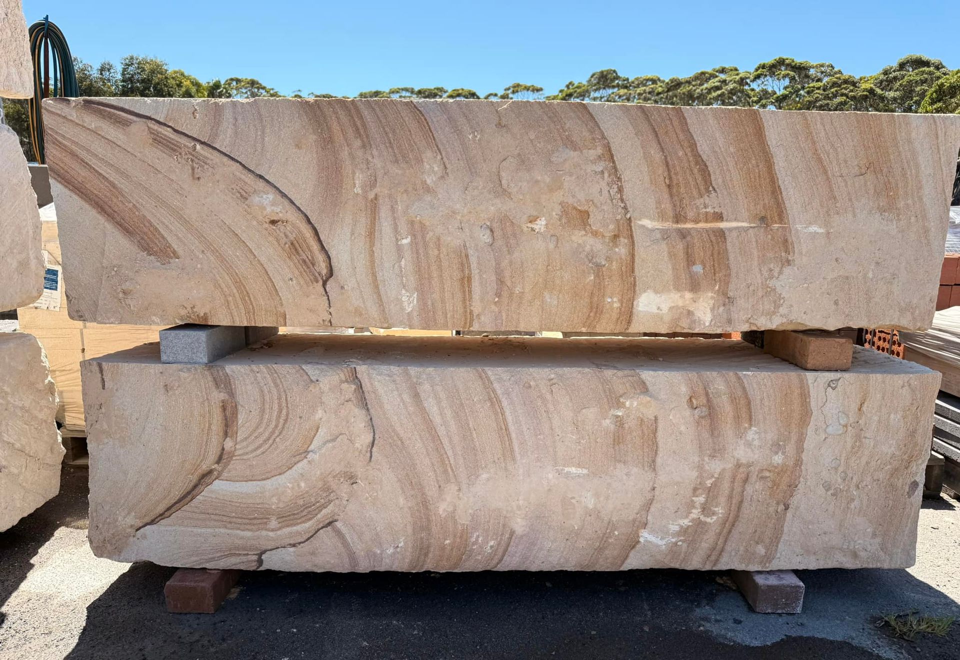 Two Large Blocks of Stone Are Stacked on Top of Each Other — Southern Bricks & Pavers In Ulladulla, NSW