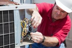 electrician working on air conditioner