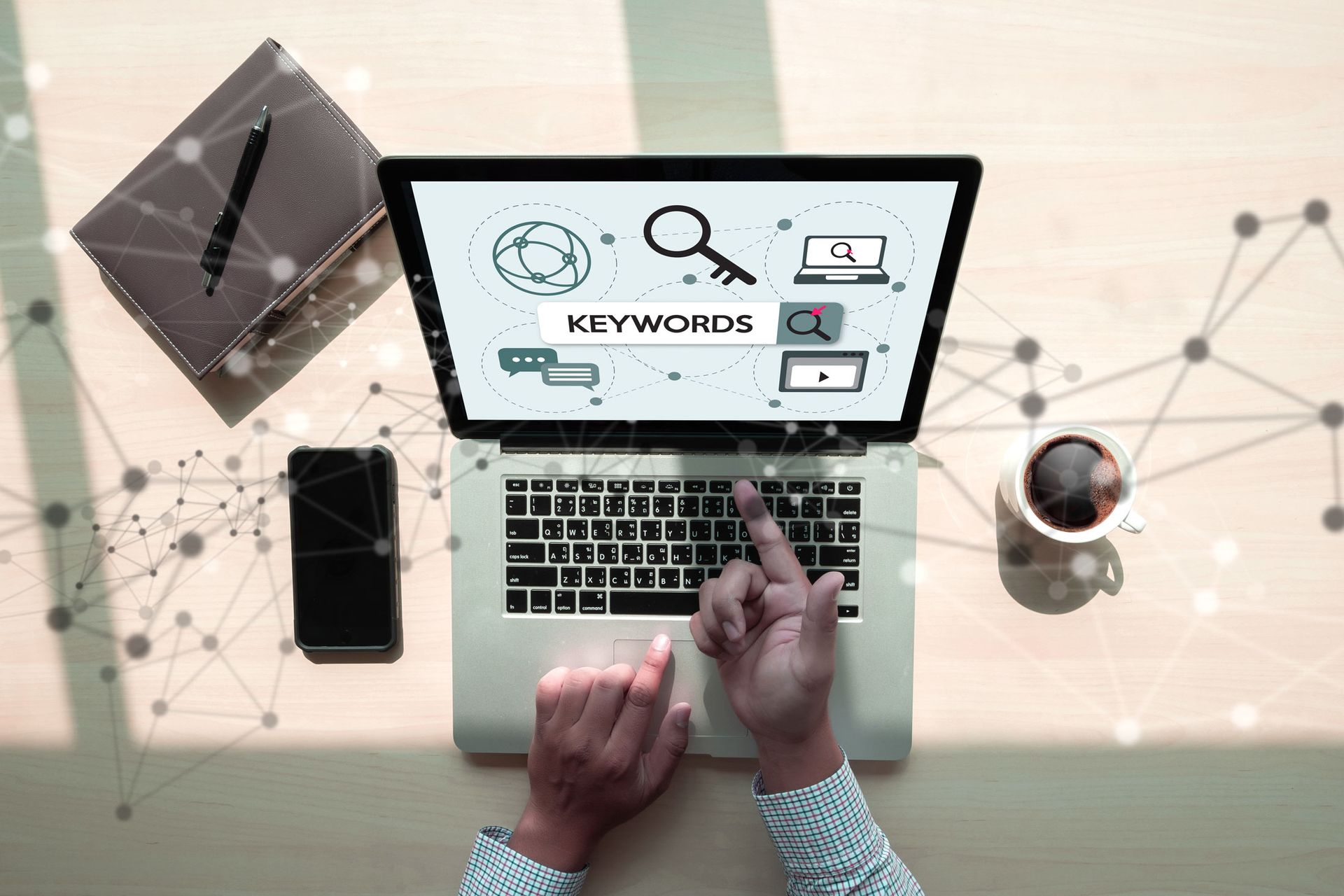 Person working on laptop, screen displaying 