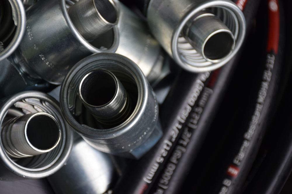 A Bunch of Metal Pipes Are Stacked on Top of Each Other — Grafton Hydraulics in South Grafton, NSW