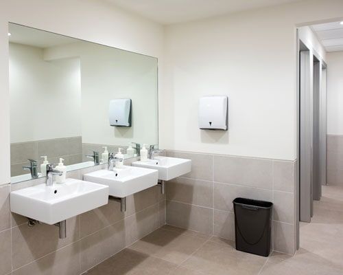 Restroom with hand basins — Plumbing Repairs in Orland Park, IL