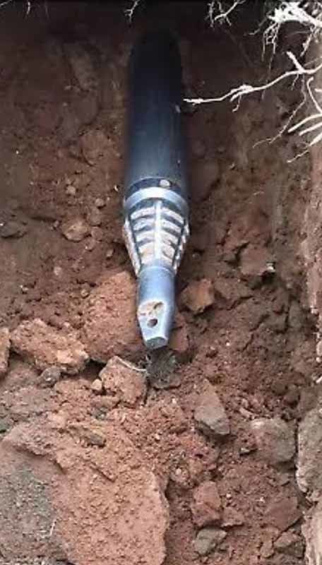 tip of drill in dirt