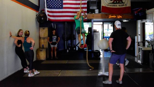 lifting weights at Shamba Vibe