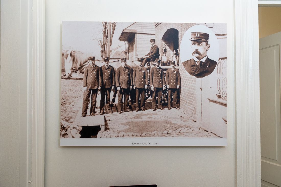 A black and white photo of a group of men standing next to each other