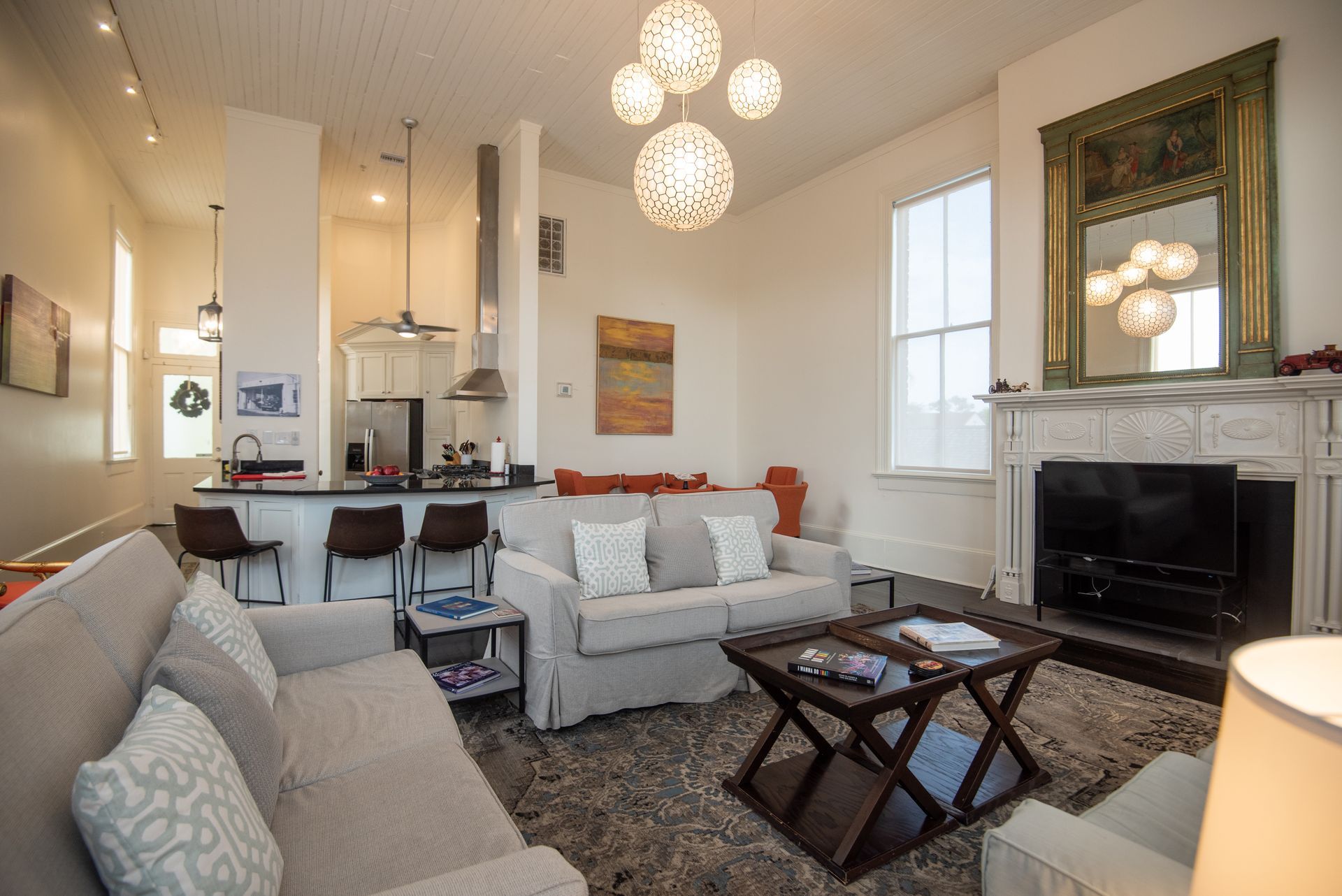 A living room with a couch , coffee table and fireplace