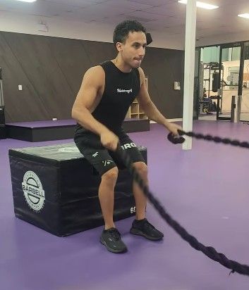 Man working out with battle ropes in gym —True Form Fitness In Gwandalan, NSW