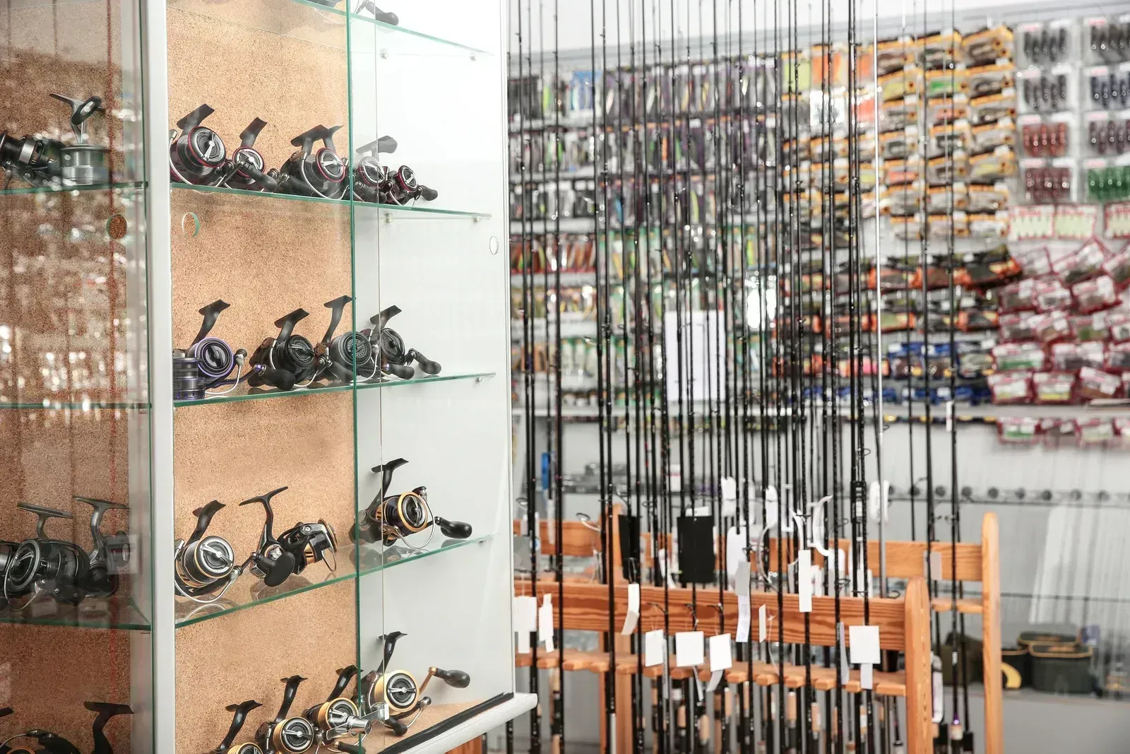 A fishing shop filled with lots of fishing rods and reels.