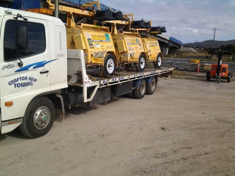 Tow Truck Loads With Heavy Equipment - Roadside Assistance in Grafton, NSW