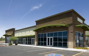 A building with a handicapped parking spot in front of it