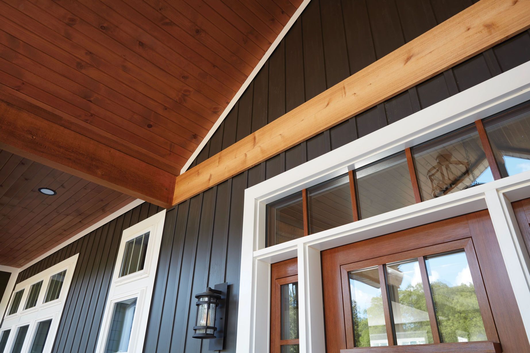 A house with a wooden ceiling and a wooden door