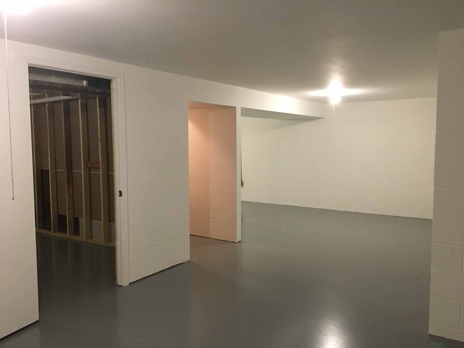 Concrete room with cinder block walls