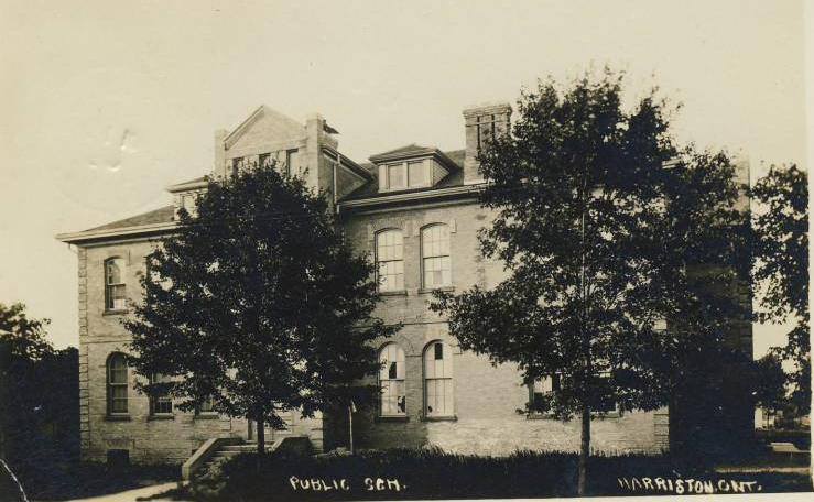 A black and white photo of a large brick building